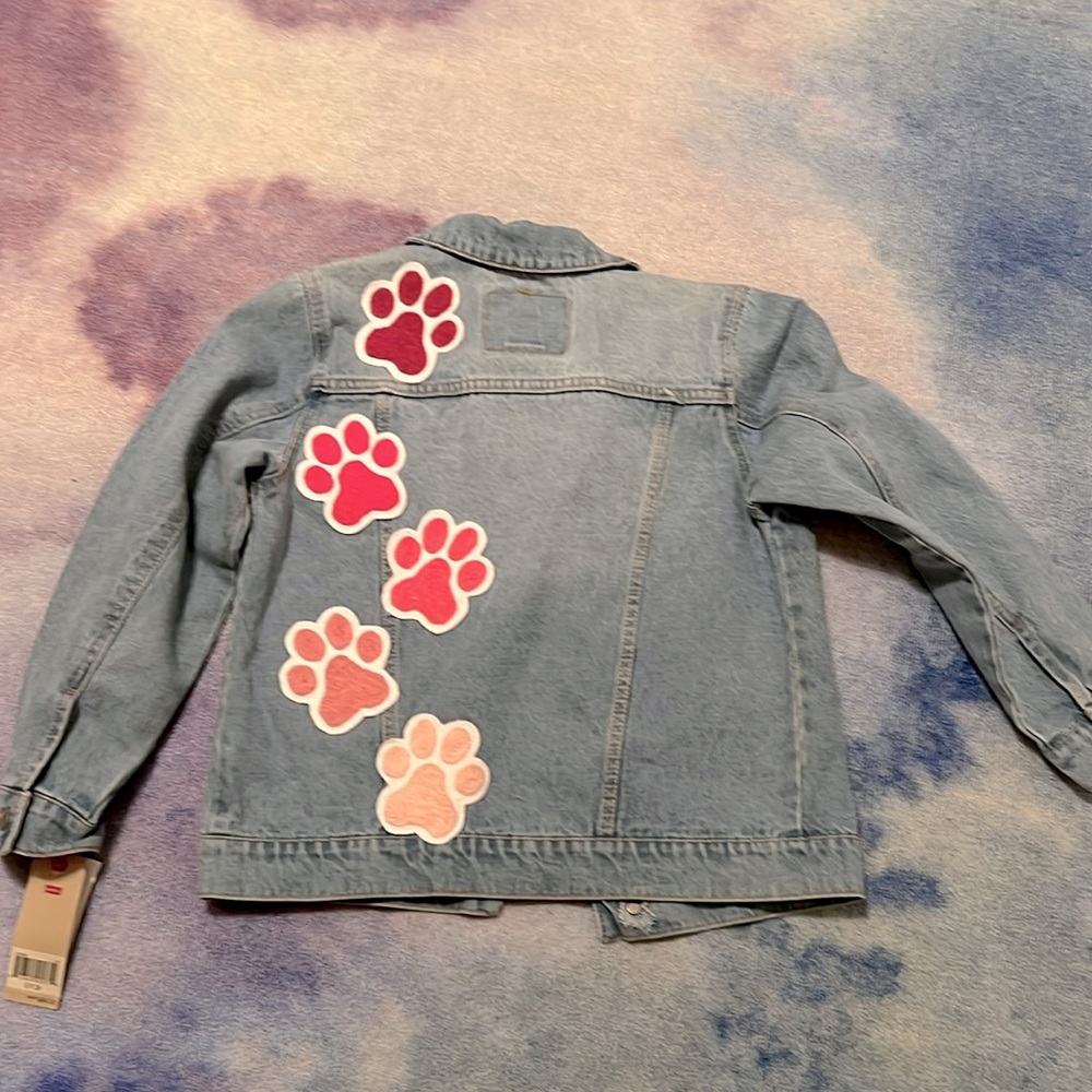 Girls Levi Strauss Jean jacket with pink paw prints. Size small (8-10 years)